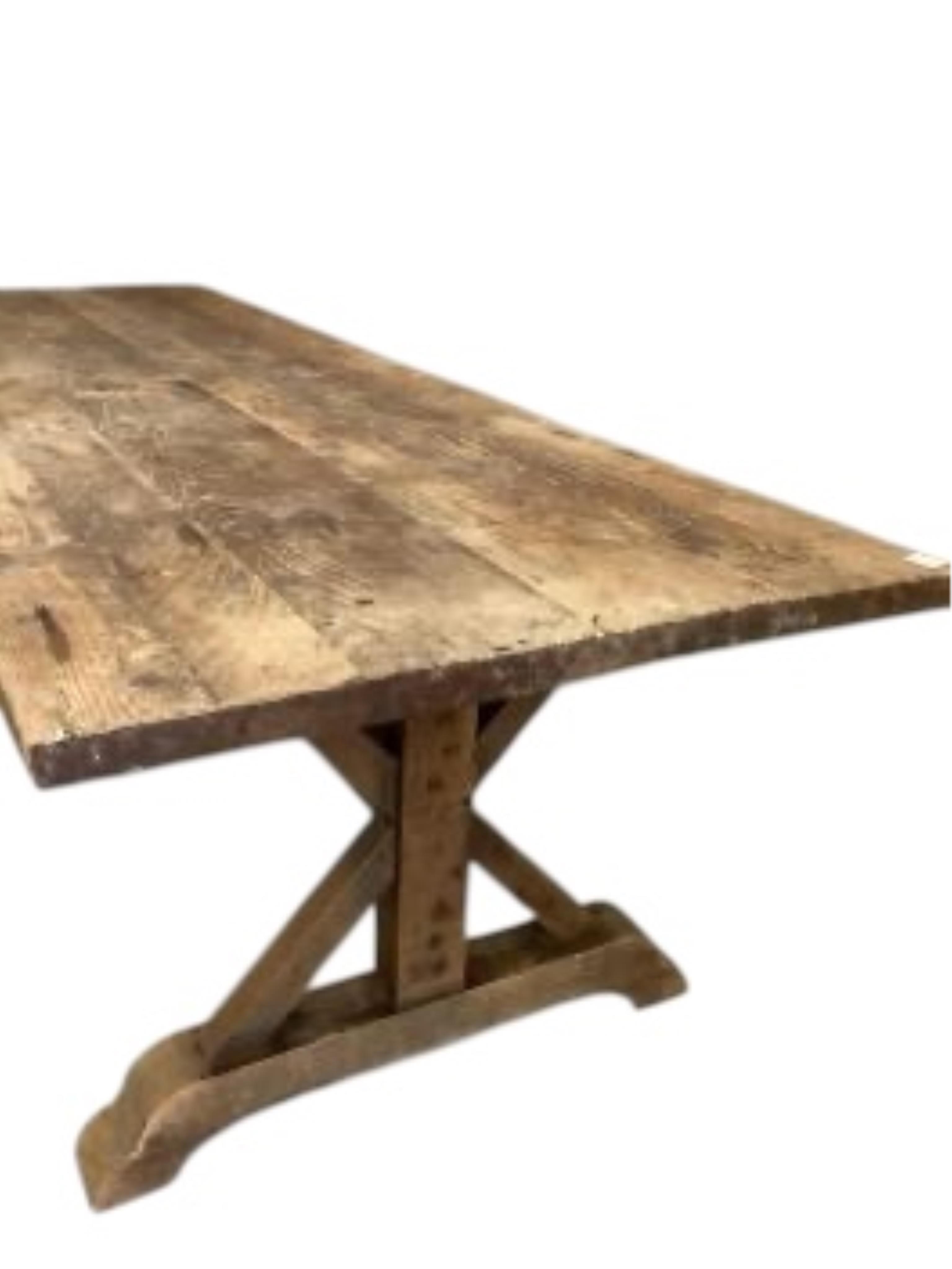 An 18th century style rectangular pine tavern type refectory dining table on X shaped underframe, width 280cm, depth 100cm, height 77cm